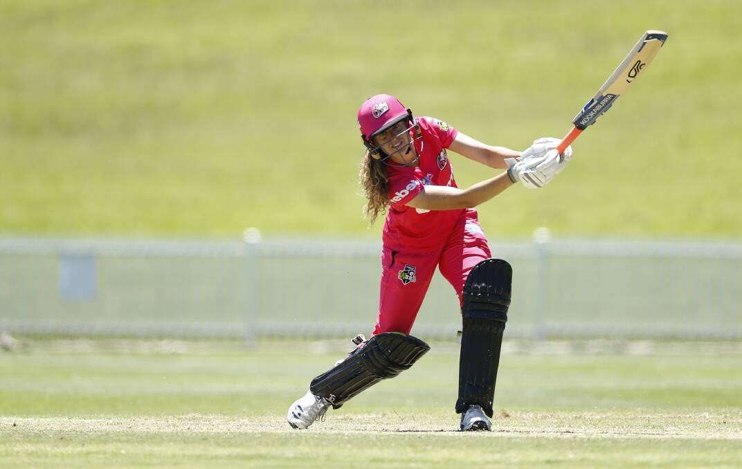 WHACK: Emma Hughes, pictured in action last WBBL season, returns to action on Thursday. Photo: GETTY IMAGES via SYDNEY SIXERS