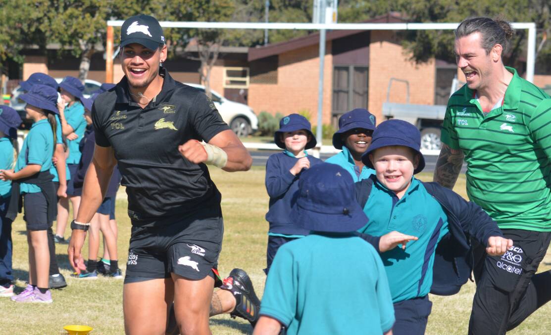 GAME TIME: South Sydney's Jaxson Paulo (left) and Ethan Lowe had plenty of fun with students on Wednesday. Photo: NICK GUTHRIE