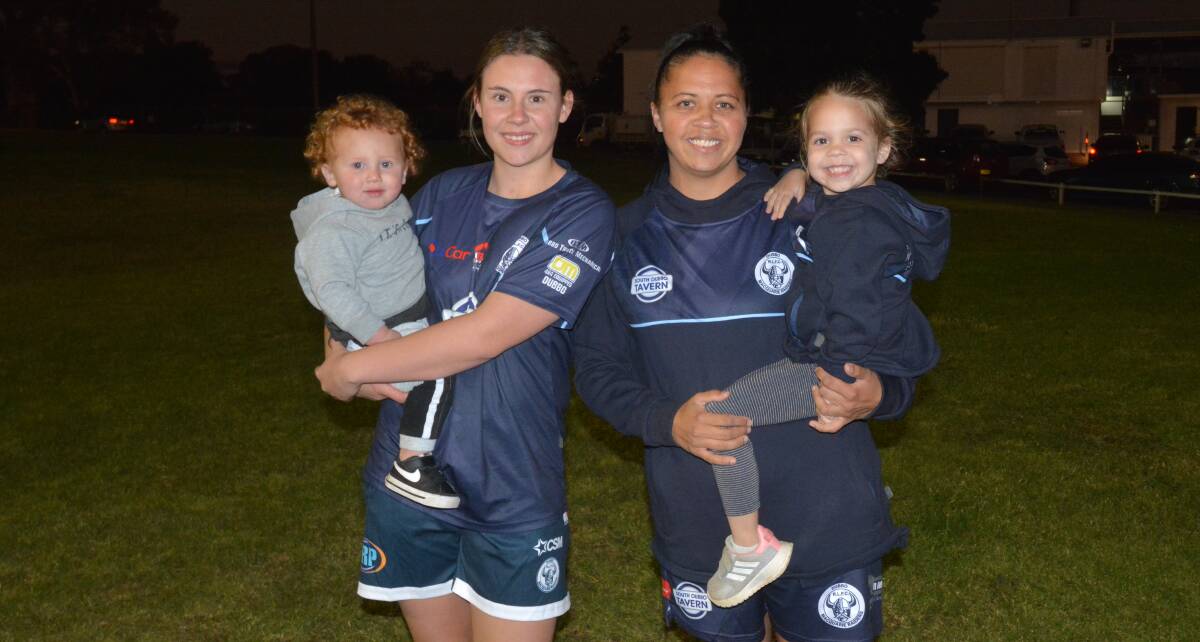 SPECIAL: Macquarie players Kiara Singh (left) and Kimberlee Gordon with their children Eli Peckham and Koa Teale-Gordon. Picture: Nick Guthrie