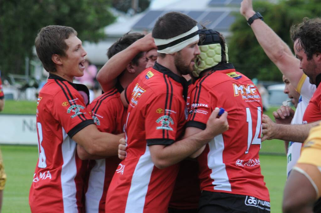 The Narromine Gorillas celebrate after scoring their first try of the season on Saturday. Picture by Nick Guthrie