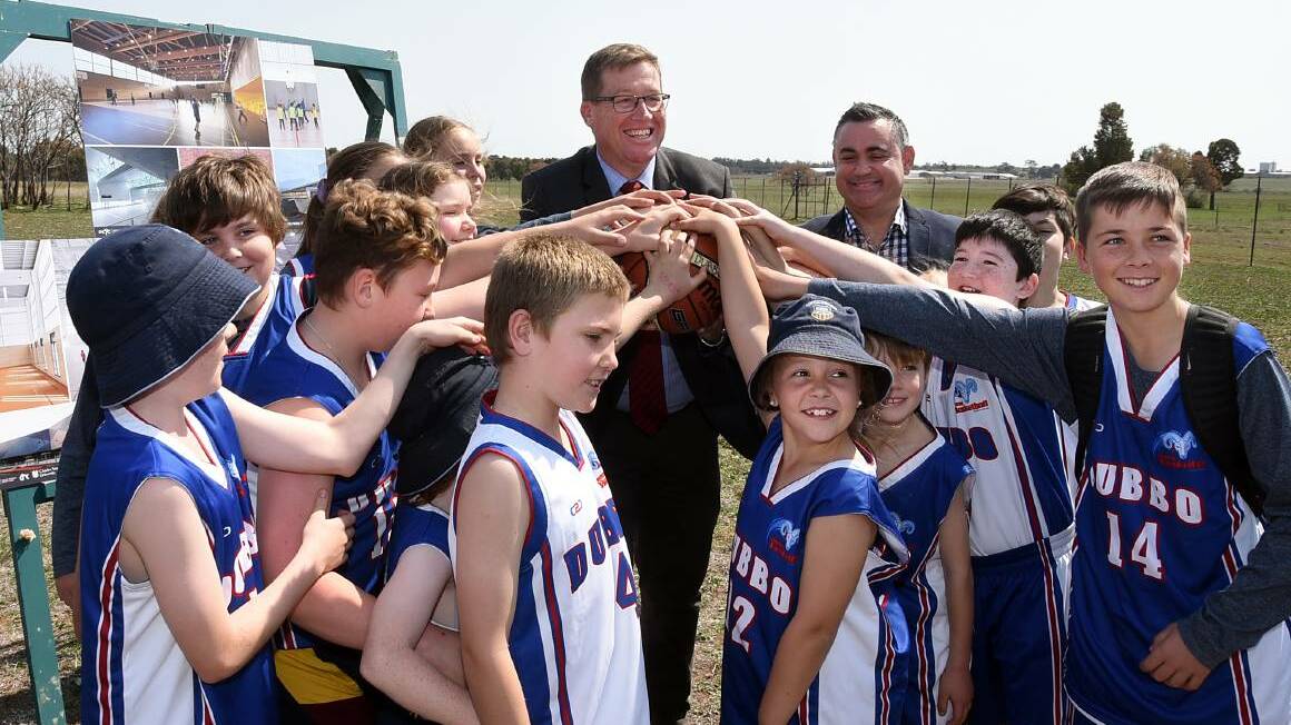 OVER THE MOON: Previous Dubbo MP with Deputy Premier John Barilaro and junior basketballers at the 2018 announcement. Photo: BELINDA SOOLE