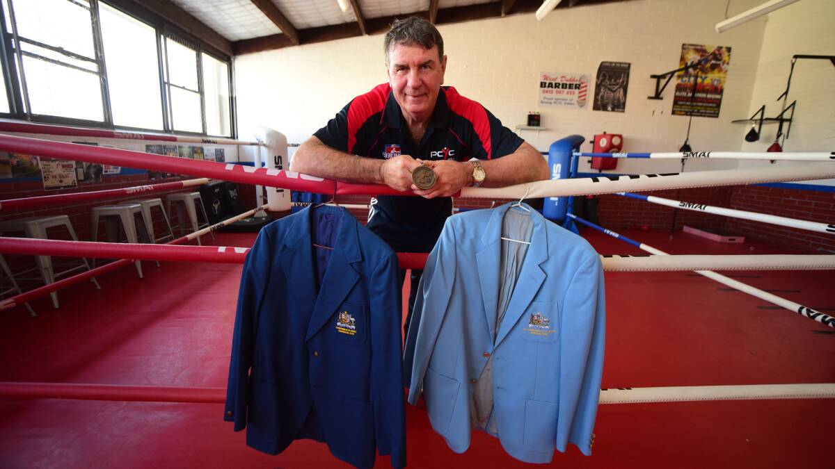 KNOCKOUT: Brian Tink with some of the memorabilia from his career. Photo: BELINDA SOOLE