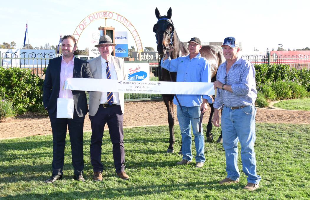 LOOKING FORWARD: Trainer Michael Mulholland (second from right) with Steamin, Turf Club officials and connections after winning last year's Gold Cup in front of a strong crowd. Photo: AMY McINTYRE