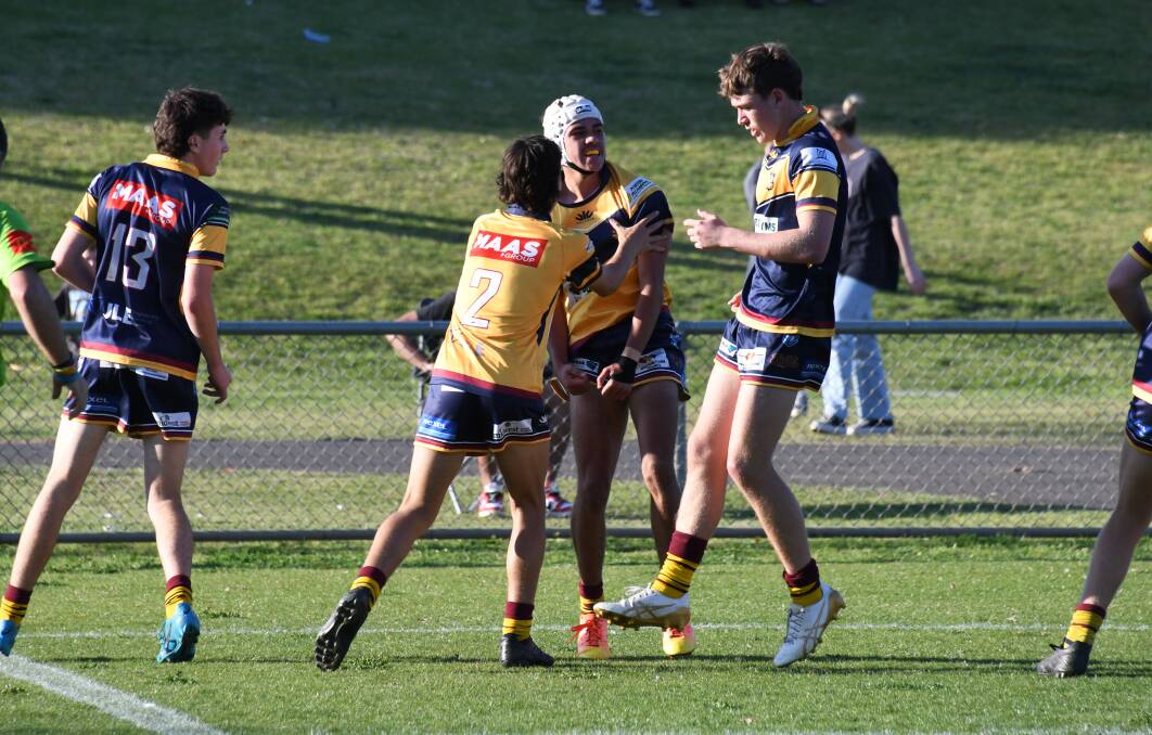 Jace Baker (centre) celebrates after scoring a try in the 2023 Dubbo District Junior Rugby League grand final. Picture by Nick Guthrie