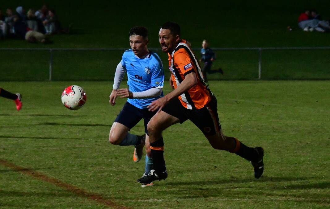BATTLE: Scott Fox (right) in action during the Western Premier League grand final in September. Photo: NICK GUTHRIE