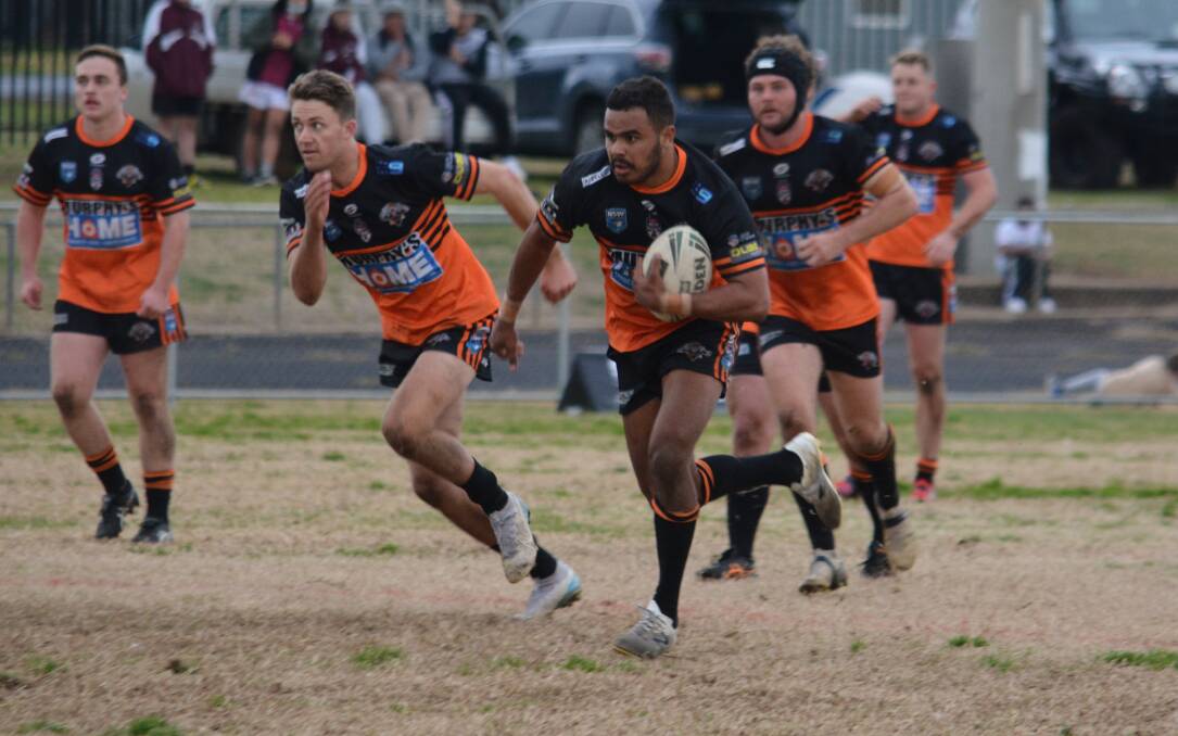 ON HIS WAY: Farren Lamb scored the all-important final try for the Nyngan Tigers at Wellington on Sunday. Photo: NICK GUTHRIE