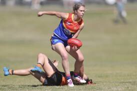 Emily Warner leaves a Giants player in her wake during the Demons' 2023 grand final win. Picture by Phil Blatch