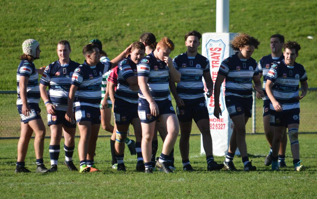 BACK AT IT: Macquarie juniors pictured after a try last season. The side will return to the park in the coming weeks. Photo: NICK GUTHRIE