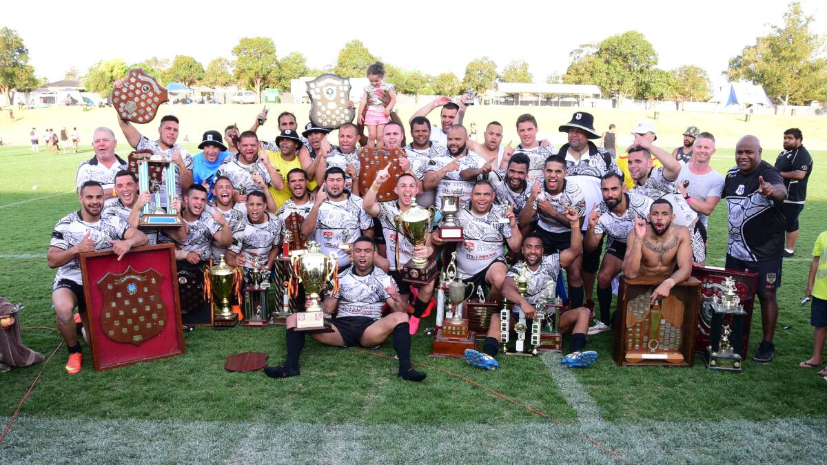 THE VERY BEST: Redfern All Blacks players celebrate their 2015 Koori Knockout victory. Photo: FILE