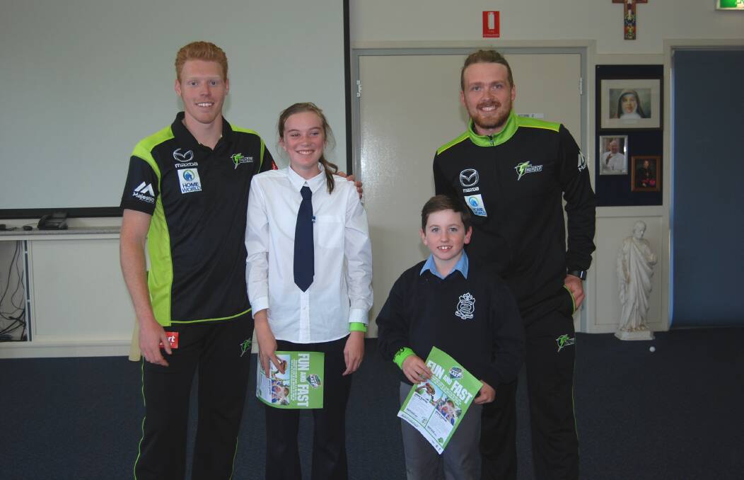 PROVING A HIT: Sydney Thunder duo Liam Hatcher (left) and Ryan Gibson with excited St Joseph's Primary School students Jasmine Bourke and Ashton Deebank earlier this week. Photo: ZAARKACHA MARLAN