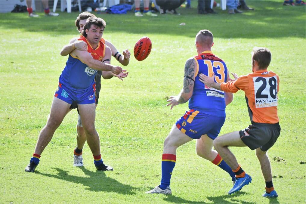 DEBUT: Brock Larance gets rid off the ball prior to being tackled on Saturday against the Bathurst Giants. Picture: CHRIS SEABROOK