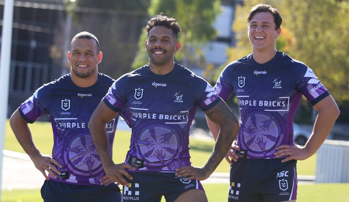 PROUD: Josh Addo-Carr (centre) shows off Melbourne's Indigenous round jersey ahead of this weekend. Photo: MELBOURNE STORM