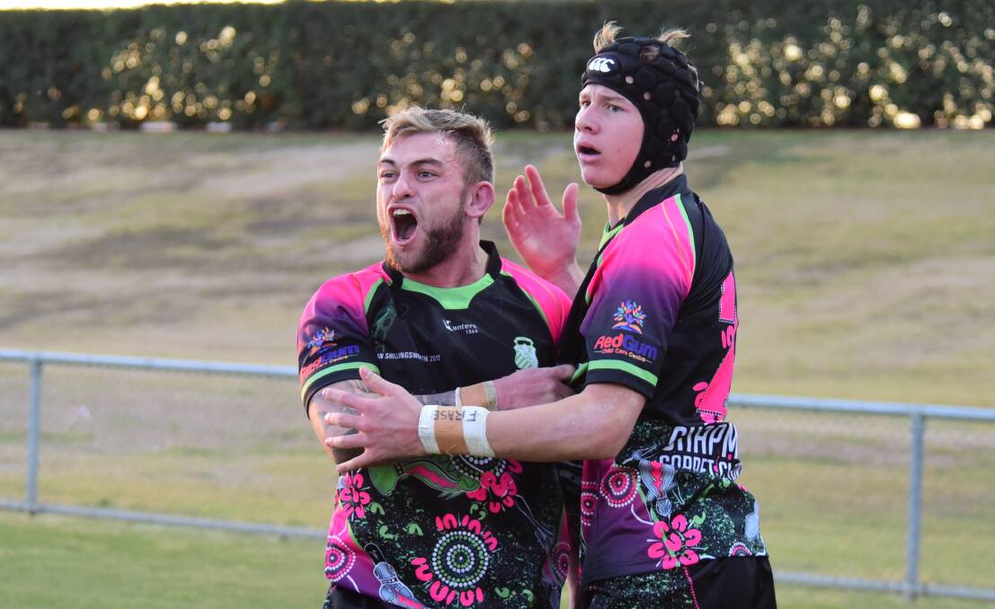 GOT IT: Jyie Chapman (left) and Matt Burton after the youngster scored his first Group 11 first grade try in 2017. Photo: BELINDA SOOLE