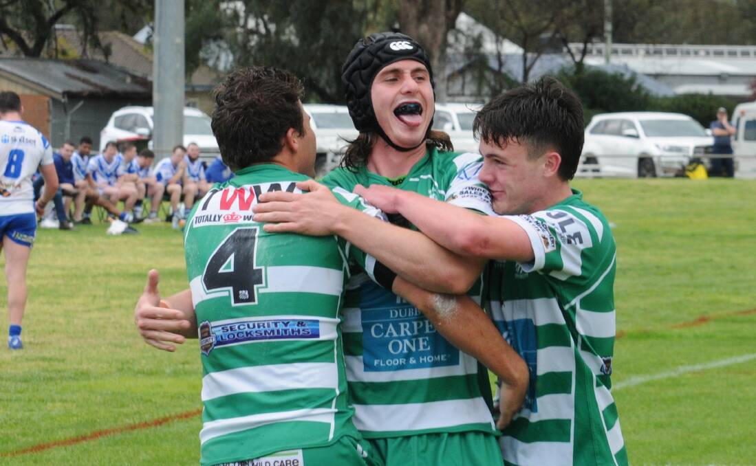 WINNING FEELING: Will Malloy (centre) celebrates after scoring for CYMS in Sunday's semi. Photo: NICK GUTHRIE