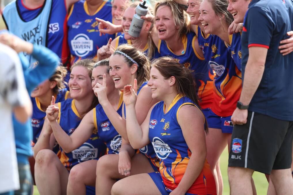 PENTHOUSE TO OUTHOUSE: The Demons women won a maiden premiership in 2018 but won't play in 2019. Photo: PHIL BLATCH