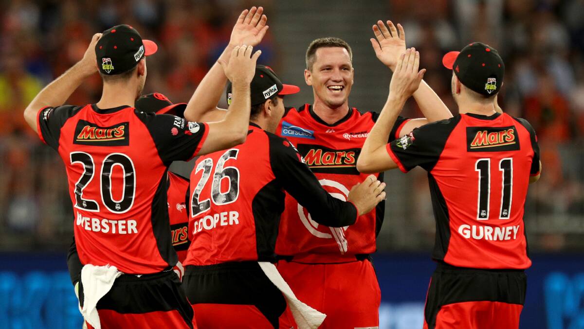 THE BIG MOMENT: Chris Tremain is congratulated by teammates after taking one of the all-important wickets on Sunday. Photo: AAP/RICHARD WAINWRIGHT