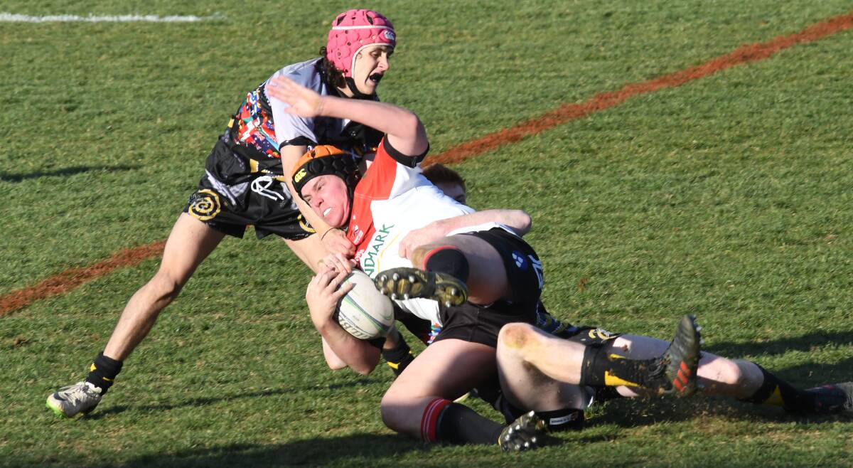CHARGING: Narromine forward Dan Treseder attempts to power through the Dubbo Rhinos defence at Apex Oval earlier this month. Photo: AMY McINTYRE