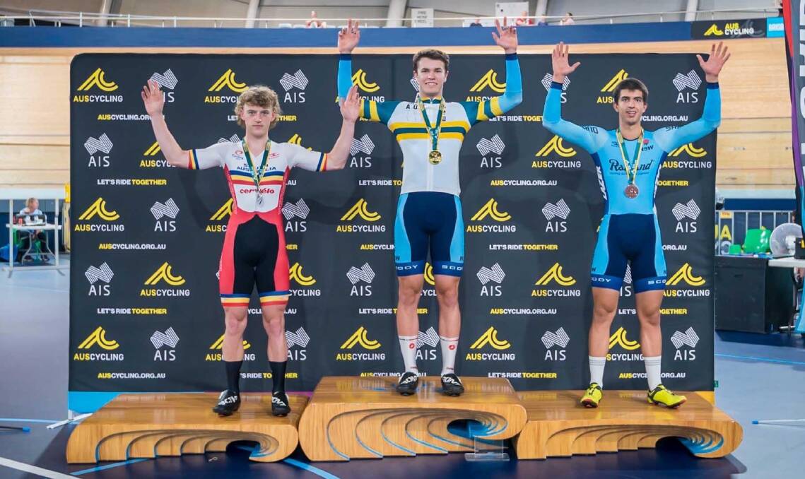 CHAMPION: Danny Barber (centre) celebrates one of his three gold medals at the recent national track titles. Photo: ELEMENT PHOTO AND VIDEO