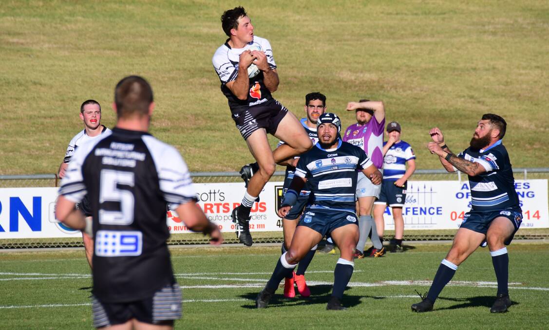 GET THERE: Mitch Andrews soars to haul in a bomb during the Forbes Magpies' frustrating loss at Dubbo on Sunday. Photo: BELINDA SOOLE