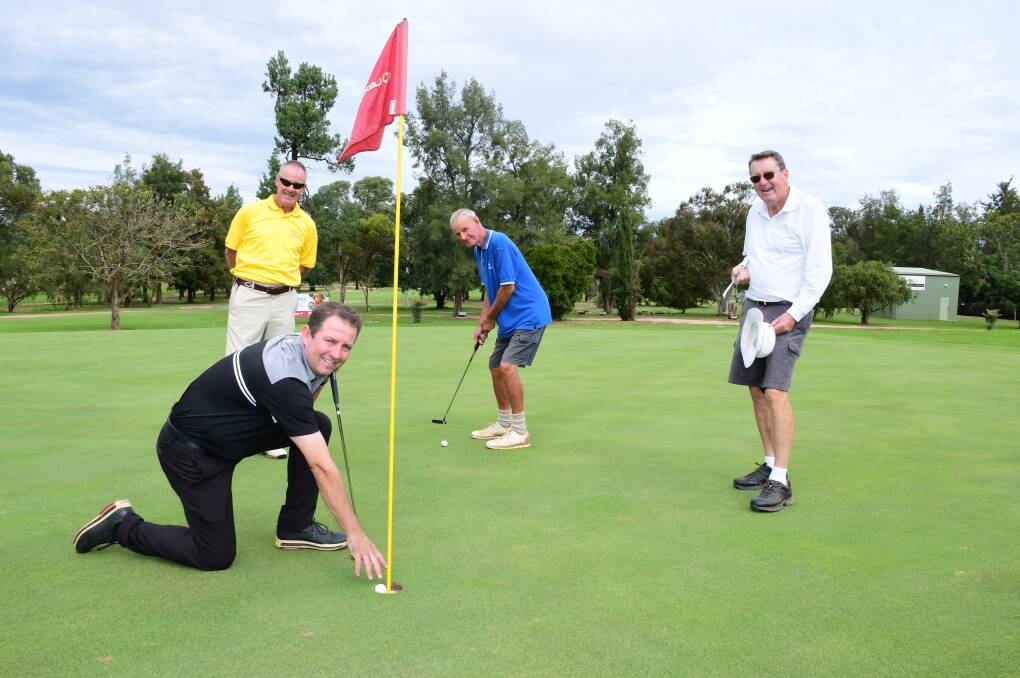 ACE: Craig Mears at one of the modified holes with golfers (from left) John Bernasconi, Nick Besseling and Bob McKeowen. Photo: BELINDA SOOLE