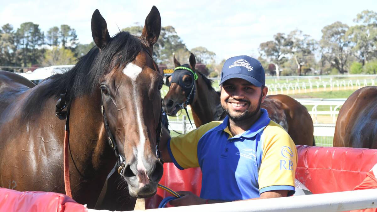 GRINNING FEELING: Tony's Reward poses for the camera along his handler after taking home a win at Towac Park. Photo: CARLA FREEDMAN