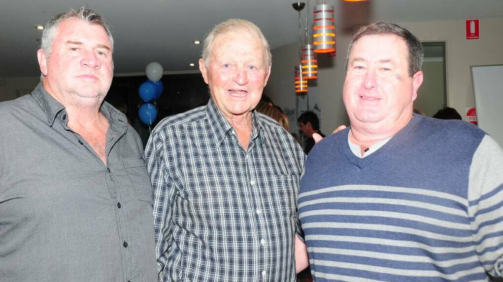 NIGHT TO REMEMBER: Barry Perry (centre) at Macquarie's presentation in 2013, where he was named a life member of the club. Photo: FILE
