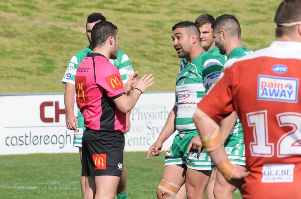 ACTION-PACKED: CYMS' Claude Gordon gets a talking to from the referee after one of the heated moments during the second half on Sunday. Photo: NICK GUTHRIE