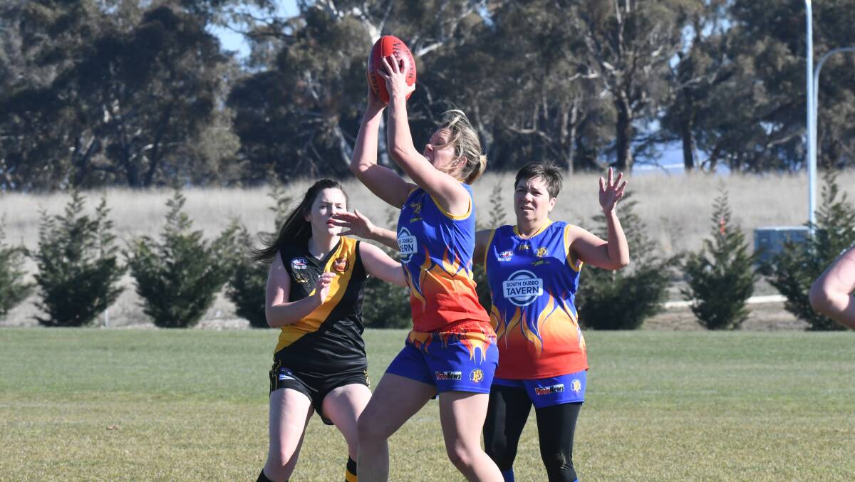 GETTING IT DONE: Emily Warner, pictured taking a mark against Orange two weeks ago, was one of Dubbo's best in Saturday's convincing win over the Parkes Panthers. Photo: CARLA FREEDMAN