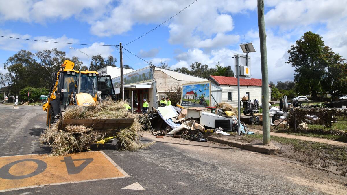 The clean-up at Eugowra began almost immediately following the flooding which ravaged the small community early in the week. Picture by Carla Freedman