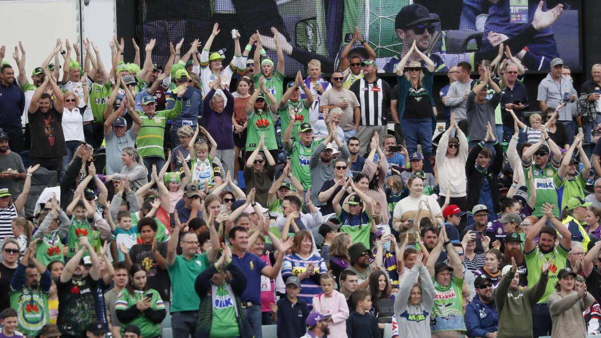 Raiders fans perform the Viking clap prior to kick-off in Canberra's game against Melbourne at Wagga in April. Picture: Les Smith