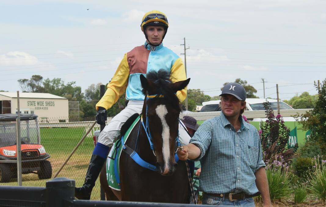 STEPPING UP: Nyngan trainer Brett Robb (right) will be in action again with Bean Hot at Dubbo on Friday. Photo: NICK GUTHRIE