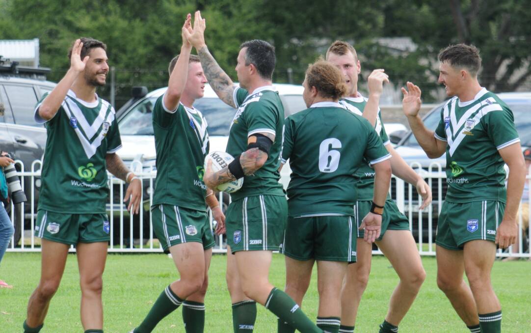 TOO GOOD: The Rams men's side celebrates a try during Saturday's win at Gulgong. Picture: Nick Guthrie