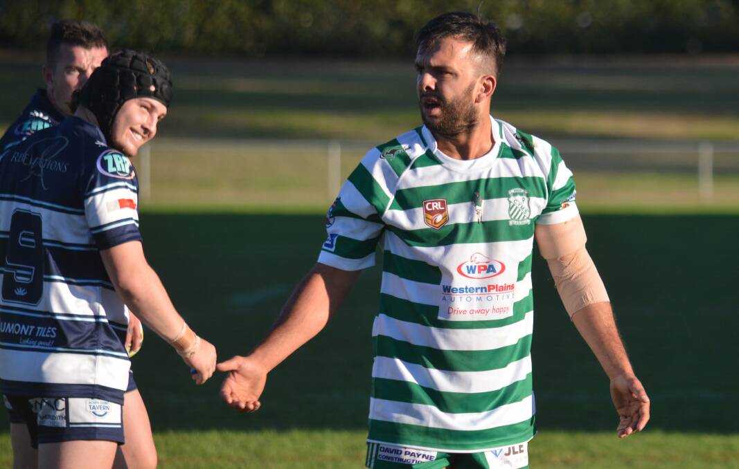 ON HIS WAY: Alex Ronayne was shocked to be sin-binned in the first half but Macquarie's Kane McDermott (left) liked the decision. Photo: NICK GUTHRIE