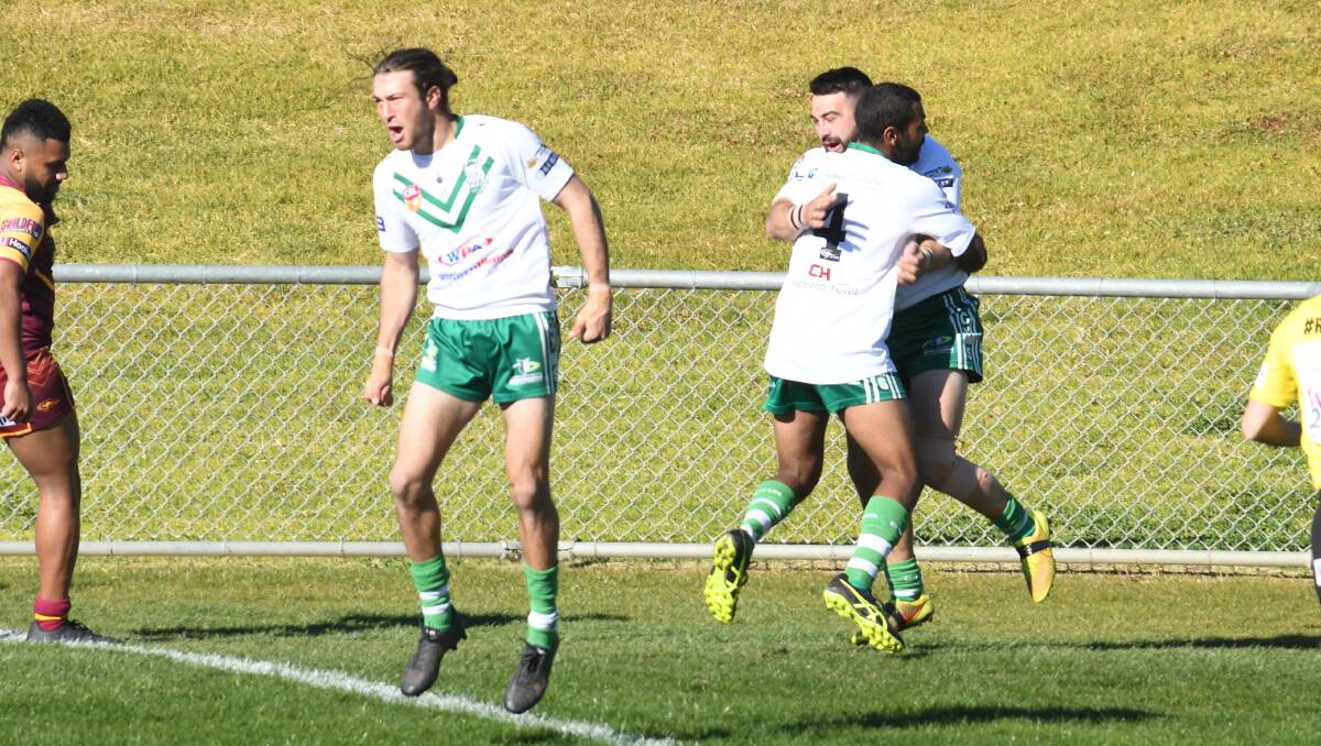 CLASS: Halfback Bayden Searle (left) celebrates after setting up Saturday's first try. Photo: AMY McINTYRE