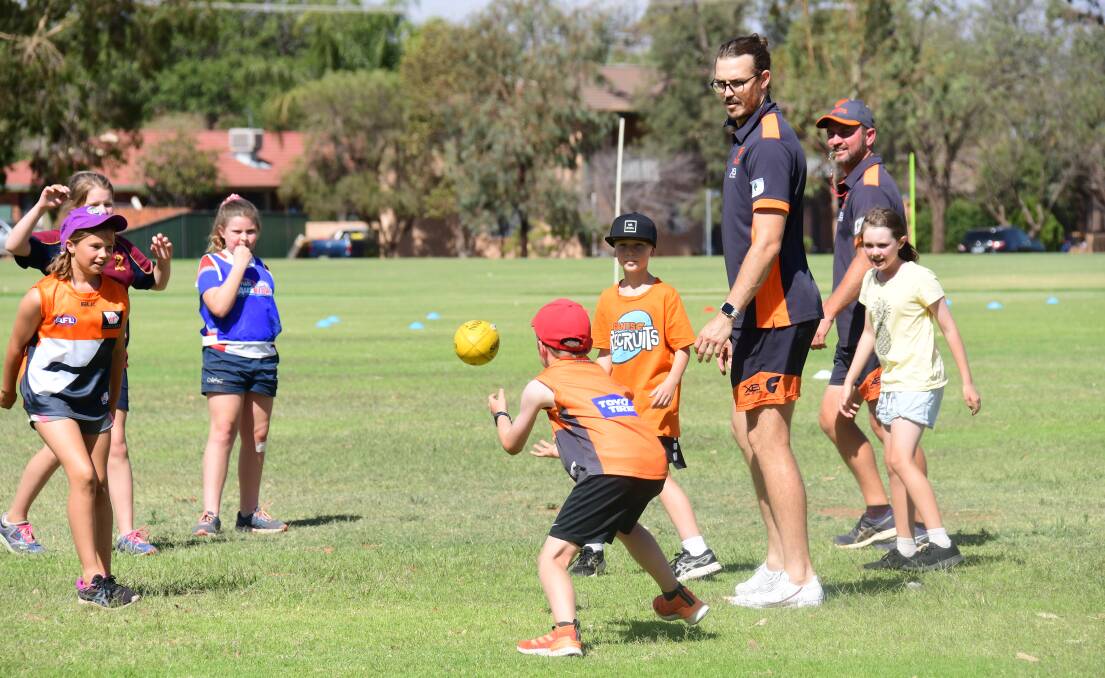 TAKING IT IN: Phil Davis was a hit during Friday's clinic with juniors at South Dubbo Oval. Photo: AMY McINTYRE