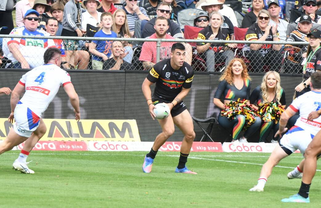 TAKE THEM ON: Forbes junior Charlie Staines looks for space during the Penrith Panthers' win at Bathurst on Saturday. Picture: Chris Seabrook