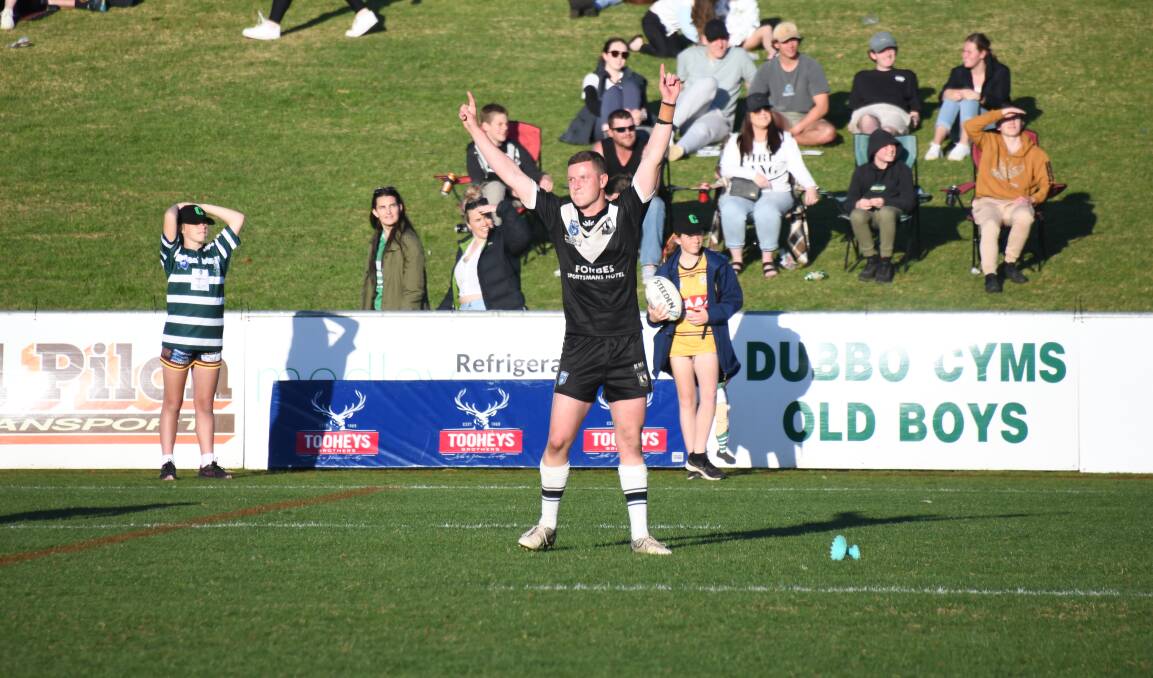 Nick Greenhalgh celebrates after kicking a penalty right on full-time in this year's grand final. Picture by Amy McIntyre