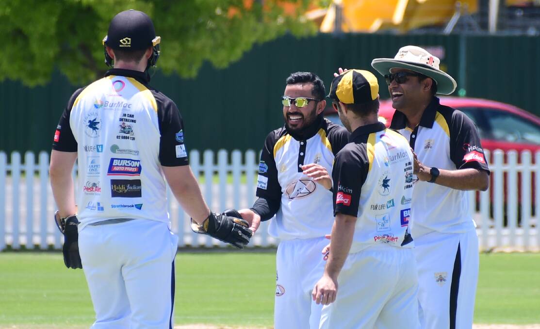 STAR OF THE SHOW: Yogi Chawla (centre) took five wickets to lead Newtown to victory over CYMS on Saturday. Picture: Amy McIntyre