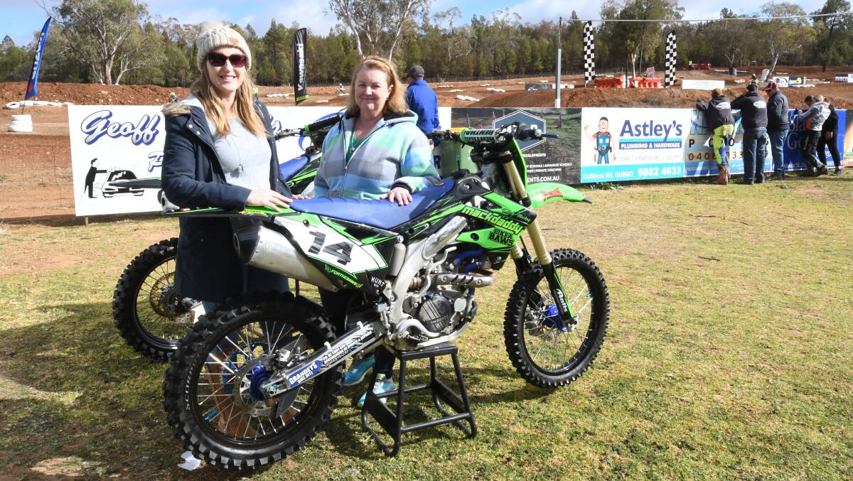 PROUD: Emma Bolton and Kerry Mackay at Morris Park with a
bike which belonged to Mitch Mackay. Photo: BELINDA SOOLE
