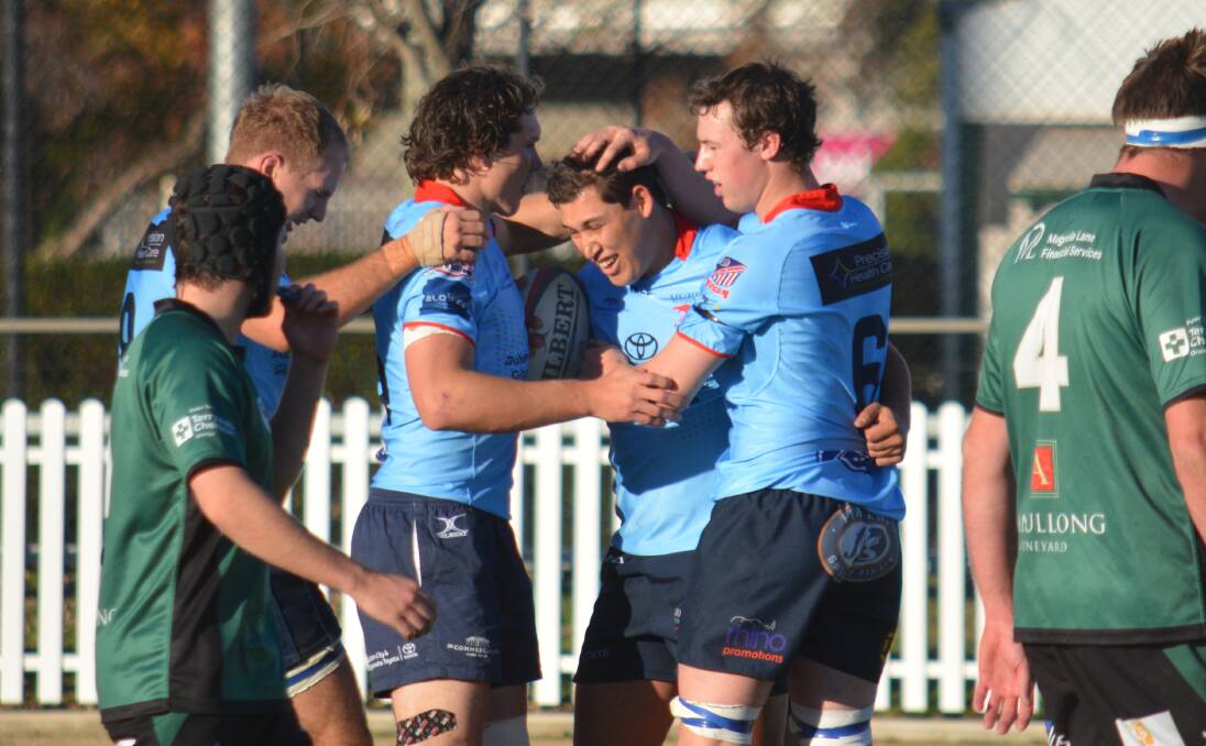 HIGHLIGHT: The Roos celebrate a try for Jake Styles (centre) during the first half on Saturday. Photo: NICK GUTHRIE