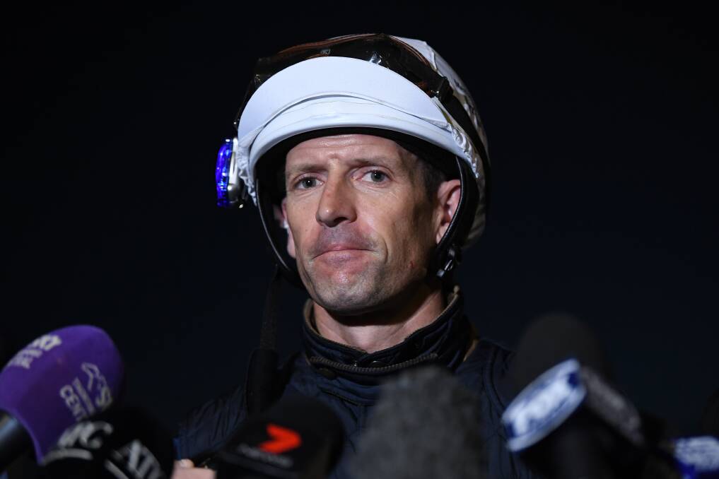 GOOD TO GO: Champion jockey Hugh Bowman speaks to the media after riding champion racehorse Winx during a trackwork session at Rosehill. Photo: AAP/JOEL CARRETT