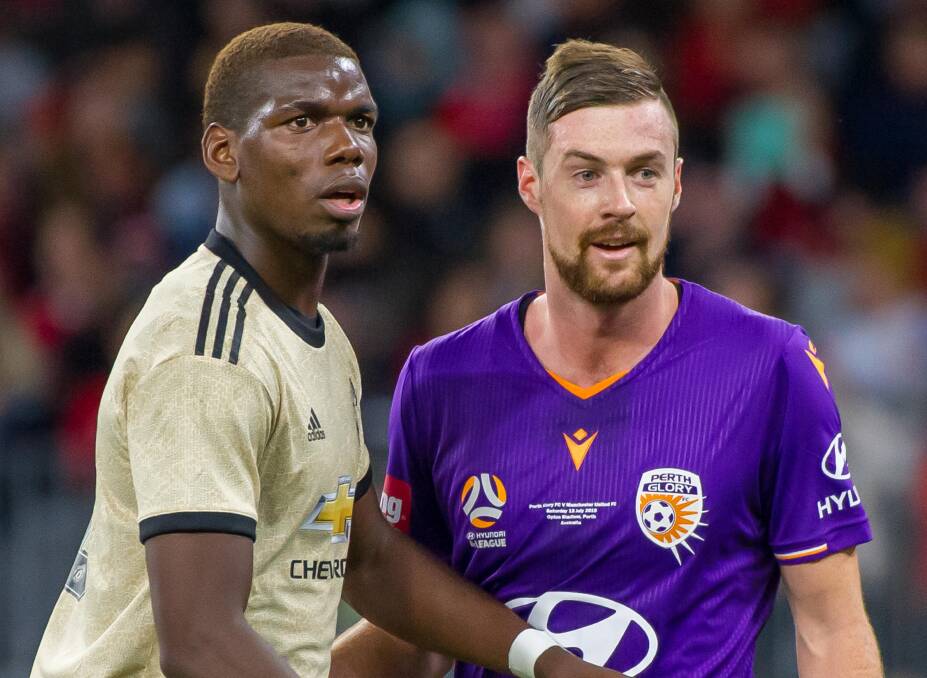 BACK AGAIN: Jacob Tratt, pictured with Paul Pogba during a Perth Glory friendly against Manchester United, has signed with Adelaide United. Photo: VISION INSPIRED PHOTOGRAPHY
