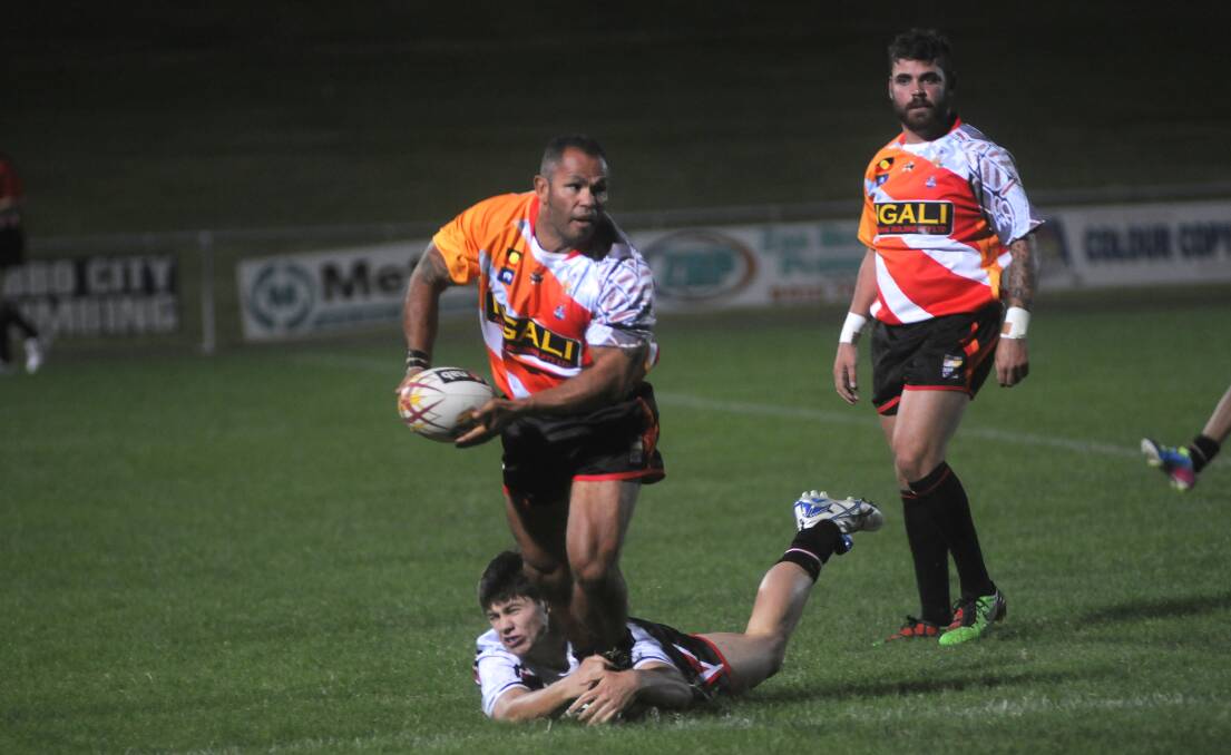 COMEBACK: Dennis Moran and Matt Naden (background) in action for the Indigenous All Stars during the 2013 match. Photo: FILE