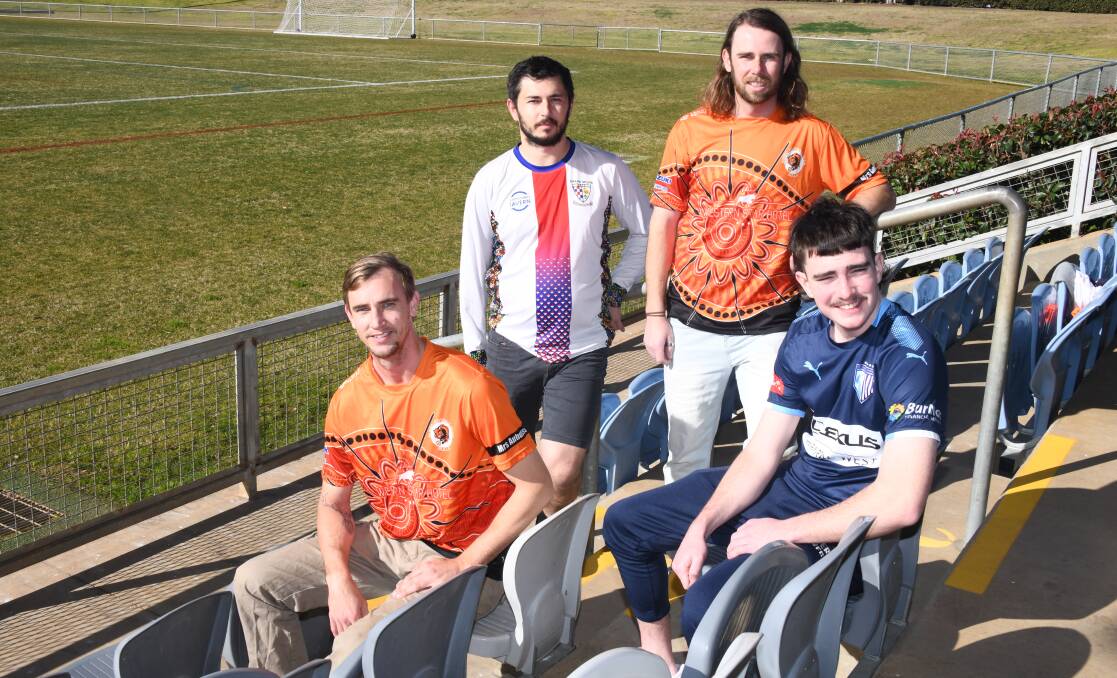 Dubbo FC pair Gareth Williams (left) and Toby Spora with Orana Spurs' Lesley Usher and Blake Smith of Macquarie United at Apex Oval ahead of the weekend's action. Picture: Amy McIntyre