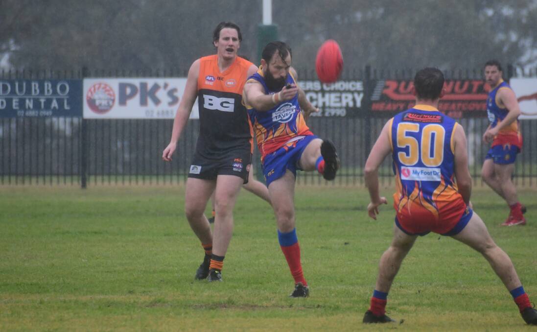 GO AGAIN: Mick Daly in action against the Giants in terrible conditions at South Dubbo Oval earlier in the year. Photo: AMY McINTYRE