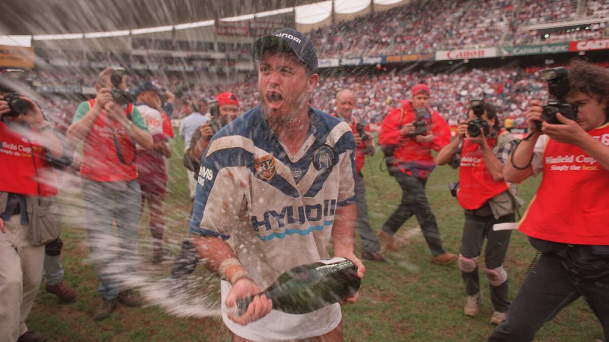 HE'S BACK: Dean Pay, pictured celebrating the Bulldogs 1995 premiership, has signed on as head coach at the club. Photo: TIM CLAYTON