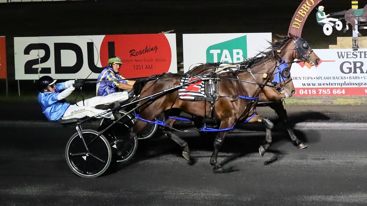 JUST GOT IT: Constantina (inside) was one of two winners for the Dubbo father-and-son team of Lloyd and James Sutton on Friday night. Picture: Coffee Photography