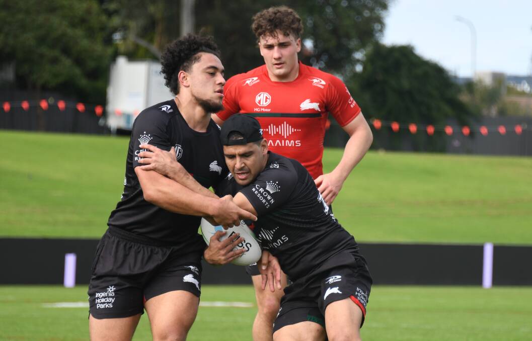 LEARNING: Ben Lovett (background) has been training regularly with the likes of Souths star Cody Walker (with ball) this year. Picture: Amy McIntyre