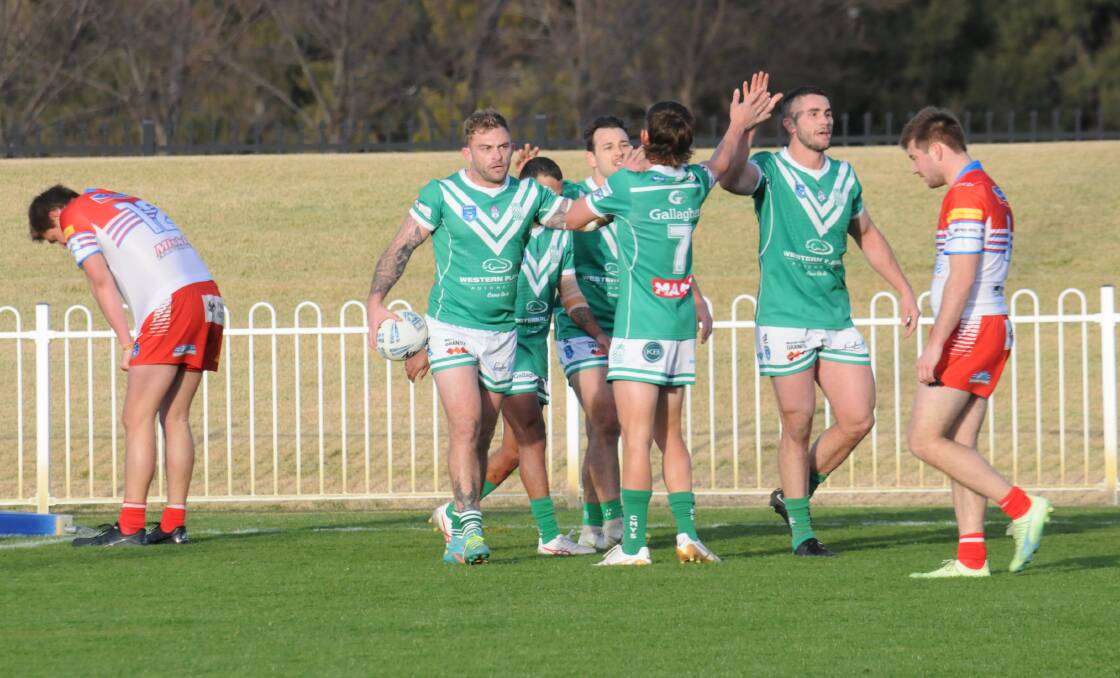 Dubbo CYMS players celebrate a Jyie Chapman (left) try during the gutsy win over Mudgee earlier in the year. Picture by Nick Guthrie