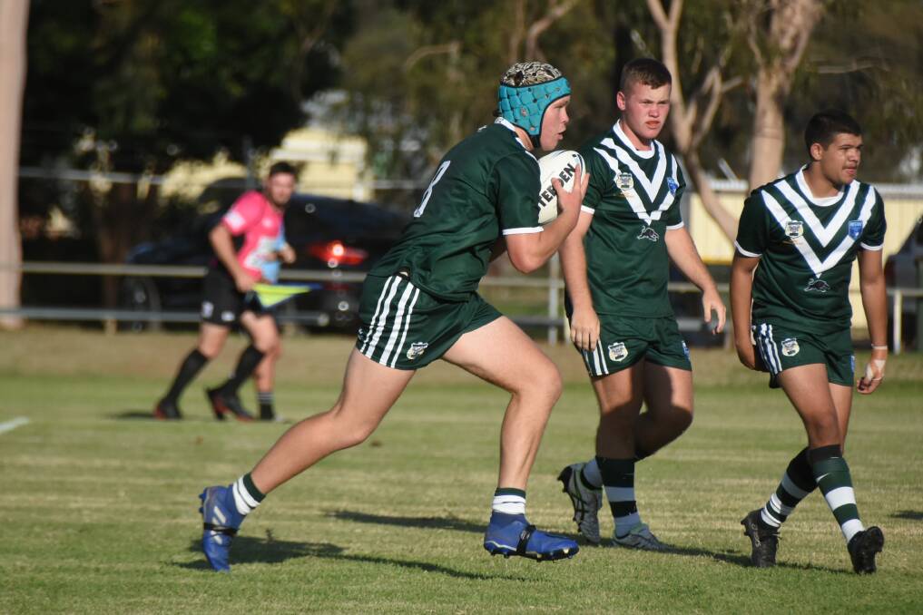 TAKE THEM ON: Lachie Large carts the ball up during the Rams' opening Daley Cup win last weekend. Photo: RENEE POWELL